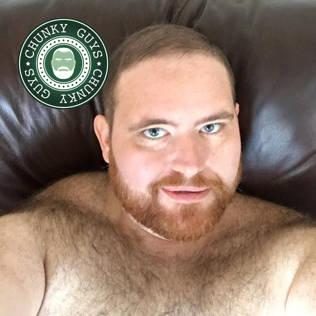Young ginger guy with hairy chest and beard