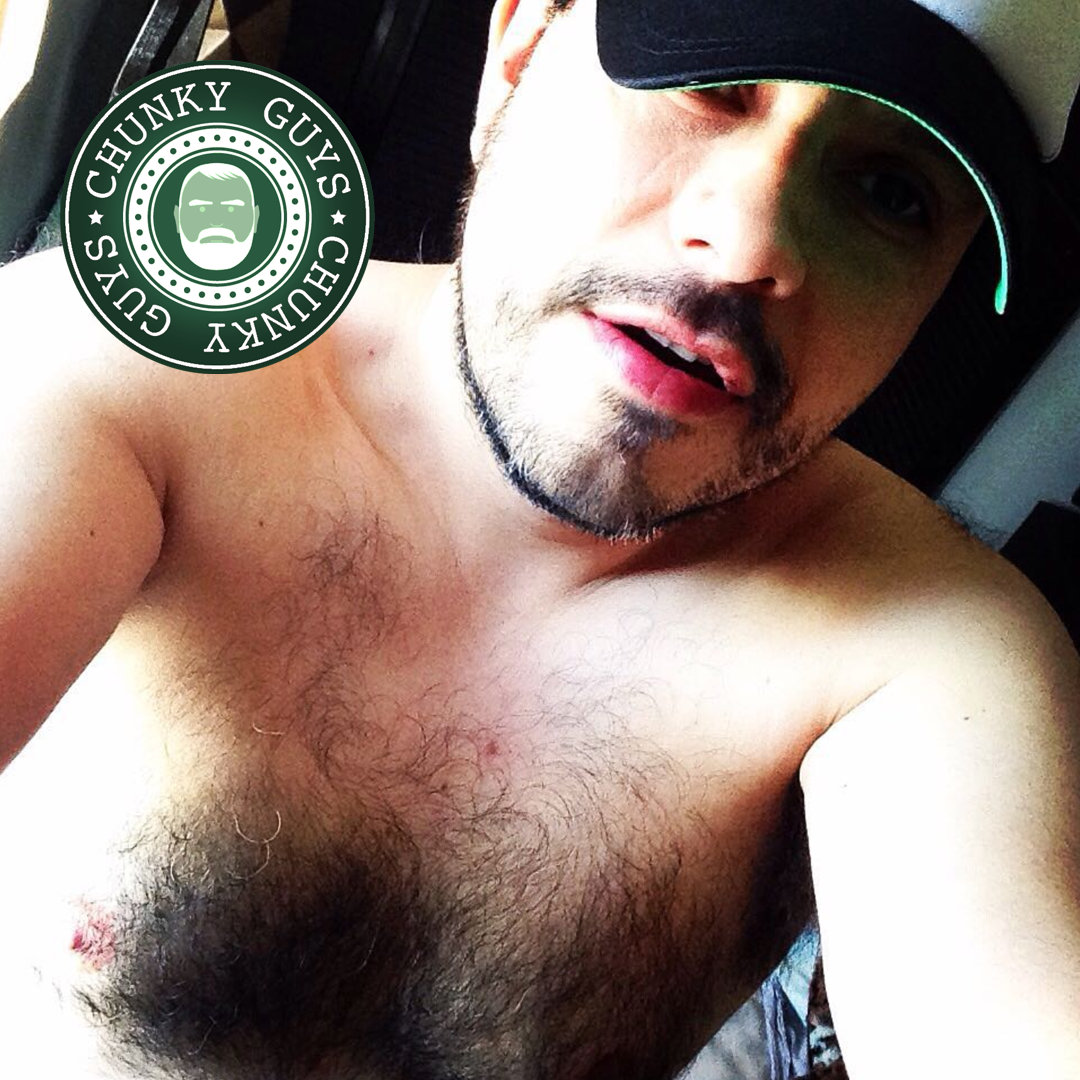 Hairy guy with stubble wearing a baseball cap